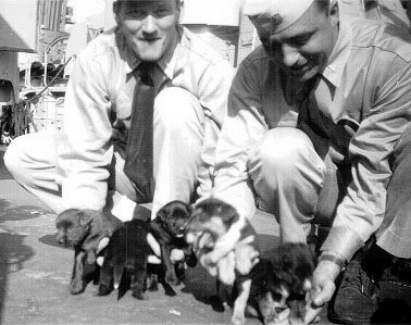 Unknown officers with Abigail Abbot’s puppies.