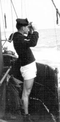 C. Woosley standing watch; 25DEC1943.