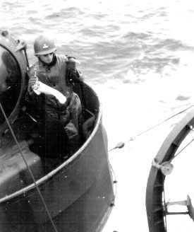 Ensign Merryman standing watch; 25DEC1943.