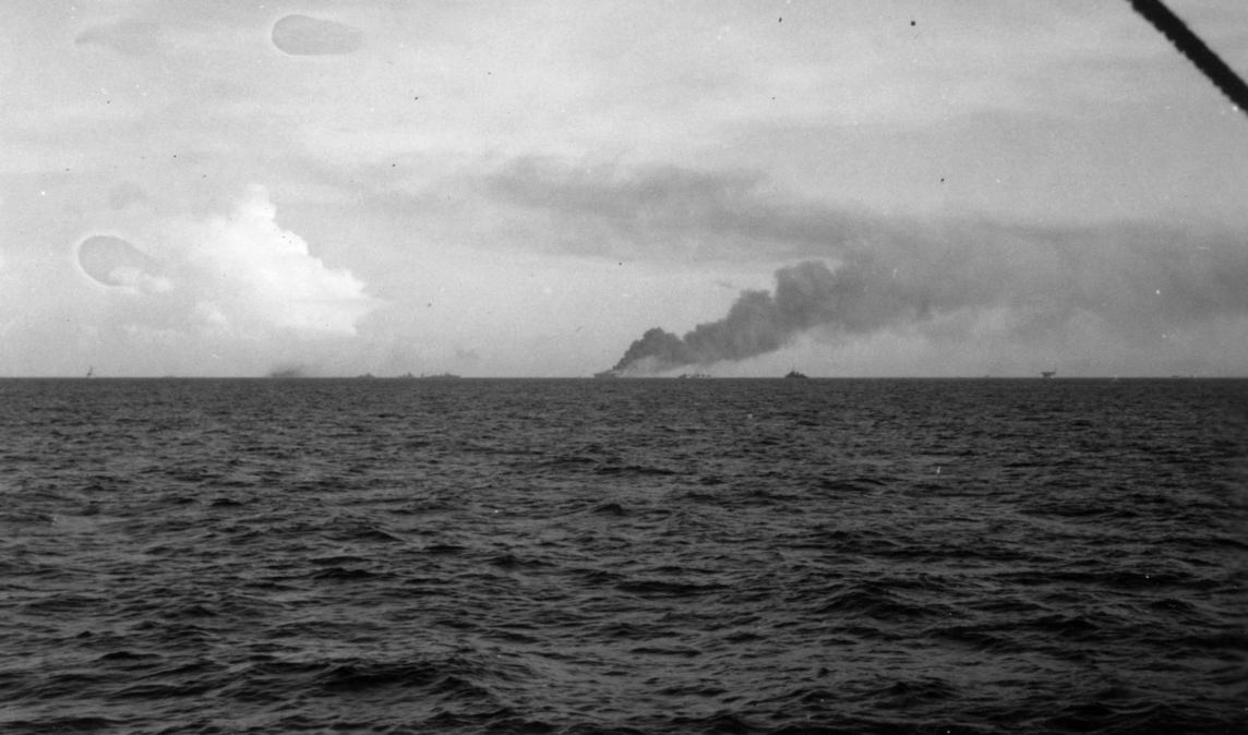 Aircraft carrier  Ommaney Bay  (CVE 79) sinking in the Sulu Sea.<br>4JAN1945.
