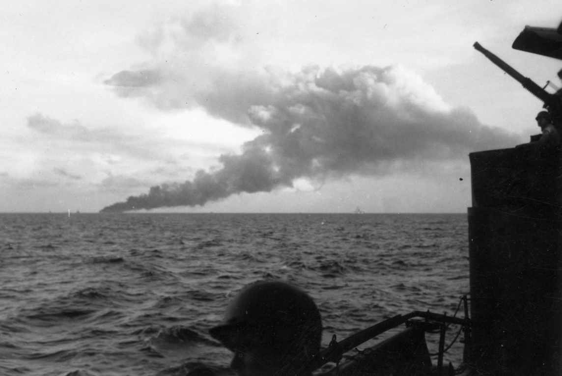 Aircraft carrier Ommaney Bay (CVE 79) sinking in the Sulu Sea.<br>4JAN1945.