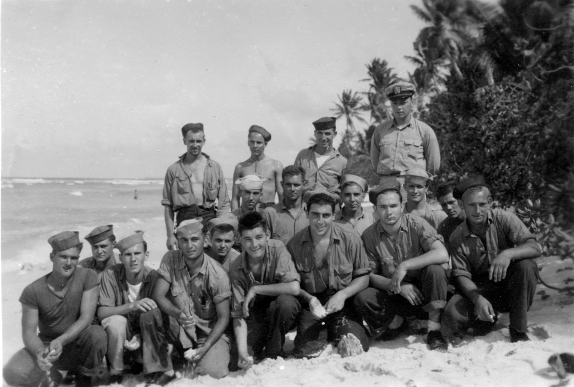 Beach party.<br>Date and location unknown.<br>Officer is Lt H. Vincent; Walter B. Sickels is in the front row far right, with blonde hair and blue cap.