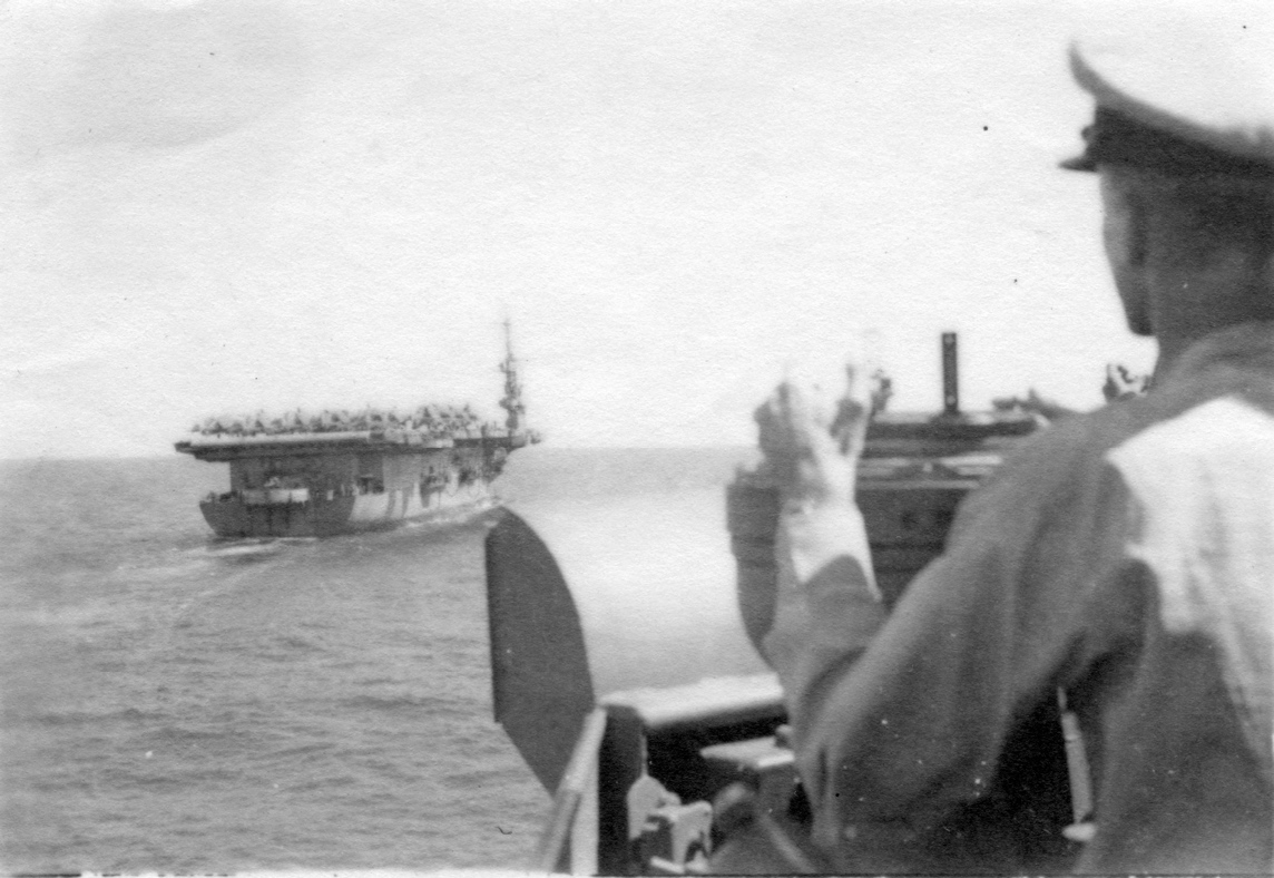 Cmdr. Dornin on the bridge.<br>Date and name of aircraft carrier are unknown.