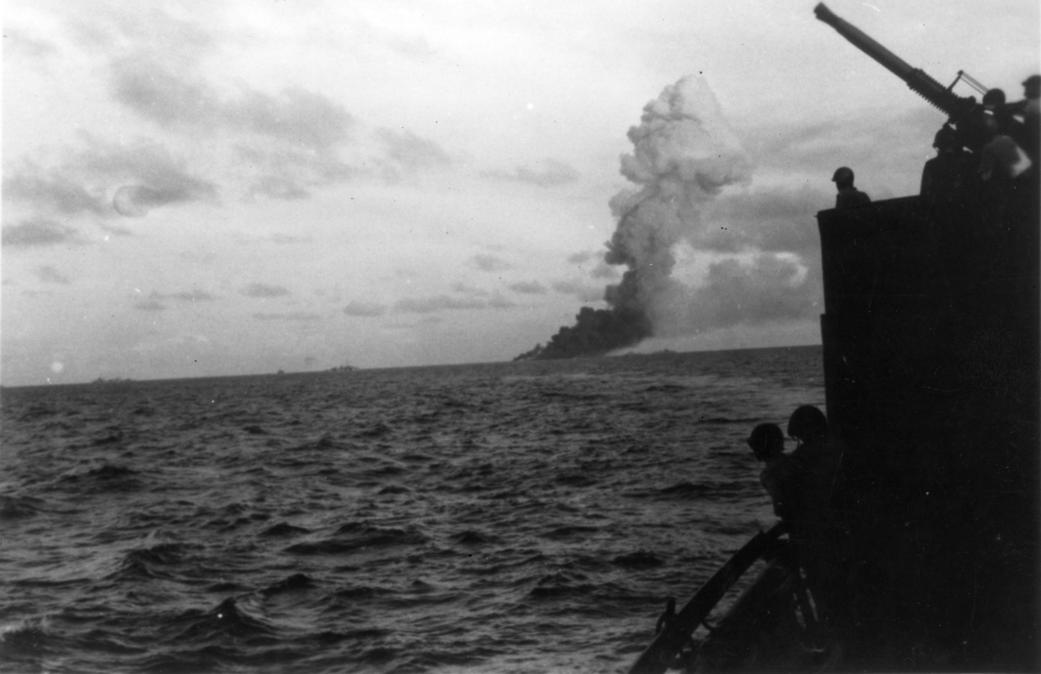 Aircraft carrier Ommaney Bay (CVE 79) sinking in the Sulu Sea.<br>4JAN1945.
