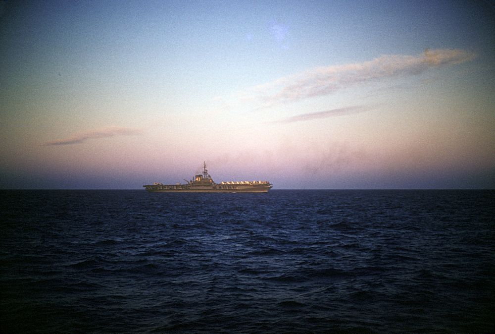 USS Coral Sea (CV 43) at sunset